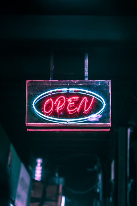 open-neon-signage