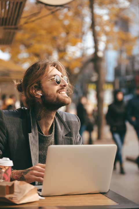 portrait-smiling-bearded-man-earphones
