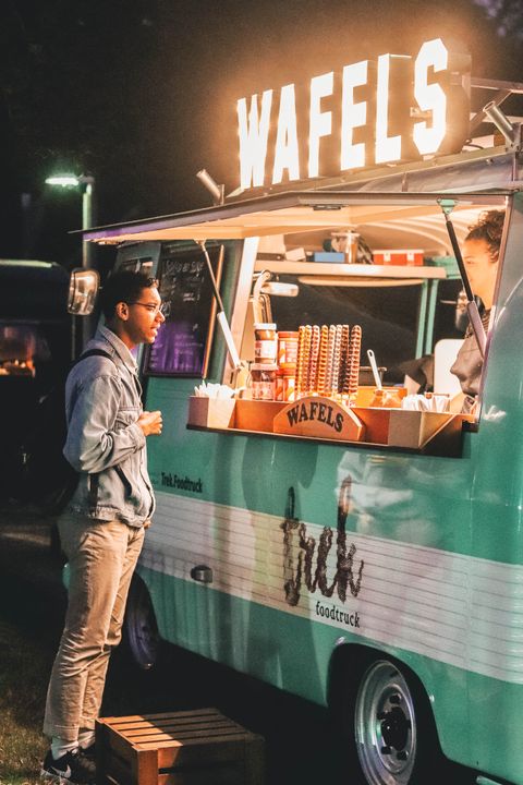 man-standing-near-food-truck