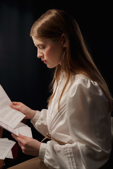 woman reading script