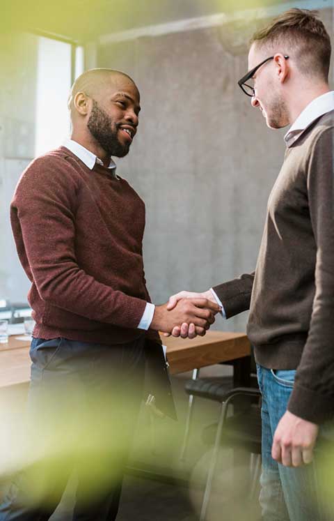 side-view-two-men-handshaking-agreement-after-meeting